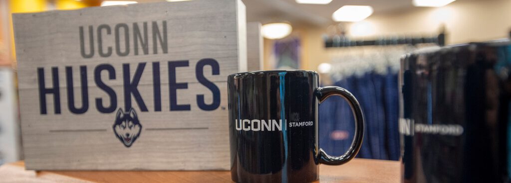 UConn Stamford coffee mug for sale in the bookstore at the Stamford campus. Feb. 2, 2023. (Sean Flynn/UConn Photo)
