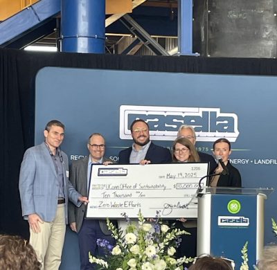 UConn Office of Sustainability accepts large check for $10k from Casella for zero waste efforts.