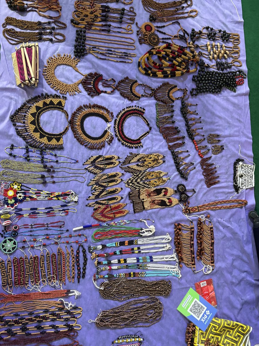 Beaded necklaces on a blanket.