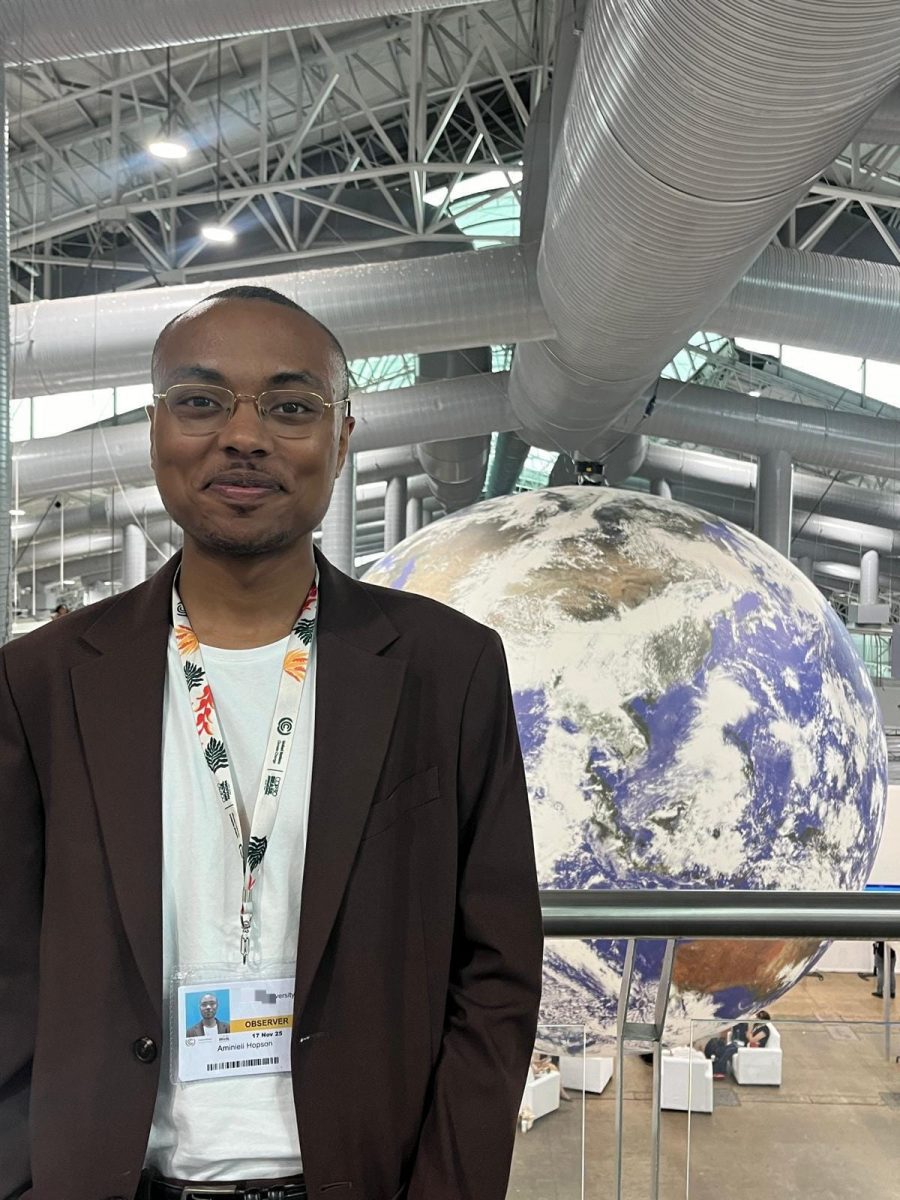 Aminieli Hopson in front of globe