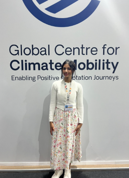 Pranavi standing in front of a COP pavilion