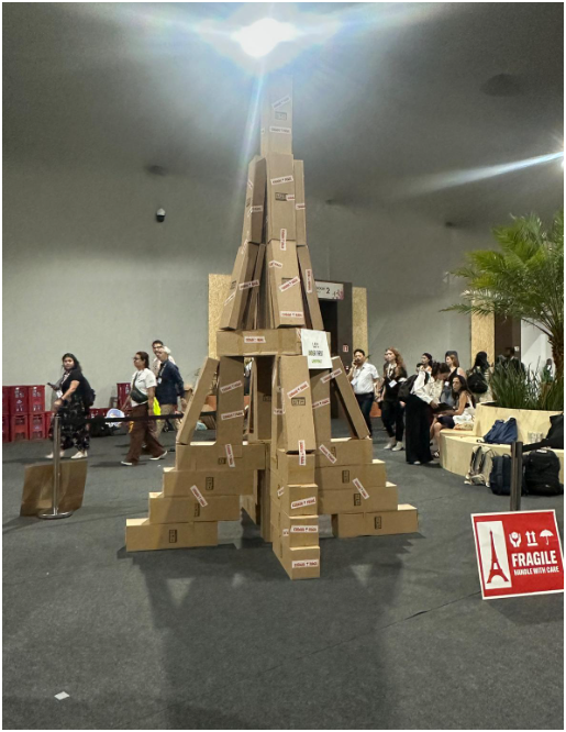 Eiffel Tower made of cardboard boxes with sign to Handle with Care
