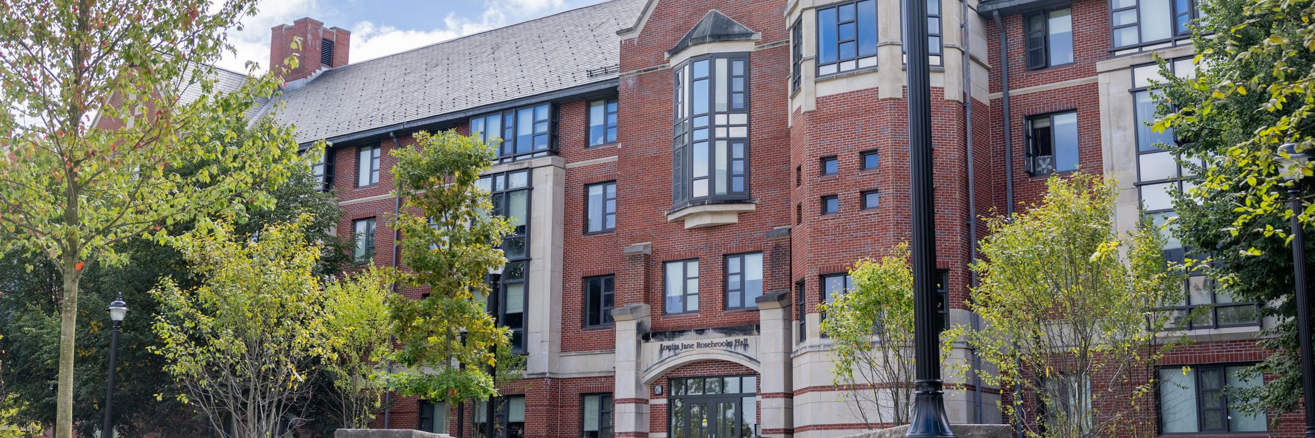 The Louisa J. Rosebrooks Residence Hall sits on a sunny day in Storrs on Aug. 20, 2024. (Sydney Herdle/UConn Photo)